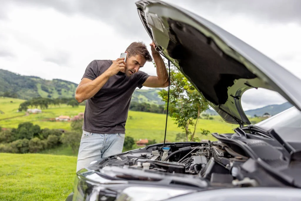 Car breakdown services.
A man open the bonnet of the car.
A men cleaning the car interior.
A man repairing the with the help of machine.
